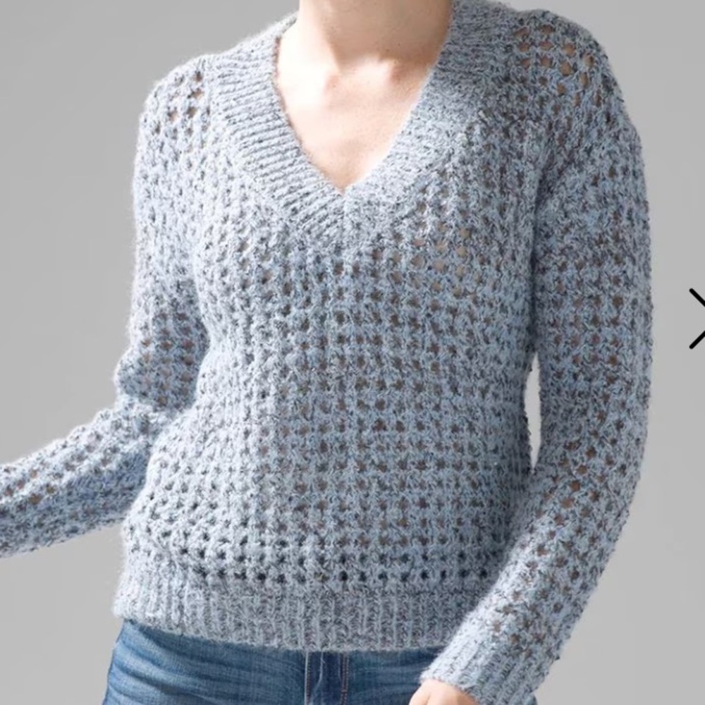 White House Black
Blue V-Neck
Sweater with Loose-Knit
Texture